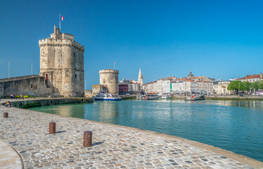 Two medieval towers at Old Port harbour at La Rochelle France - obrazy, fototapety, plakaty