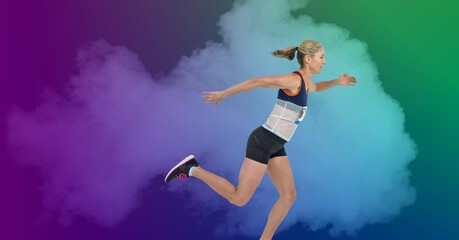 Fototapeta na wymiar Composition of athletic woman running over smoke on colorful background