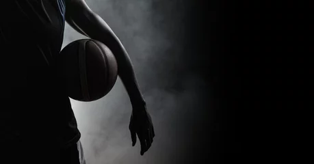 Foto op Plexiglas Composition of athletic male basketball player over smoke on black background © vectorfusionart
