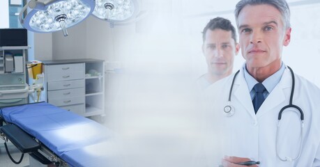 Obraz premium Composition of diverse group of doctors and operating theatre with motion blur