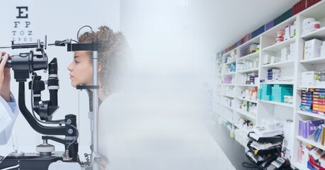 Composition of diverse doctor and patient using vision tester and pharmacy interior with motion blur