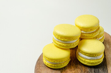 passion fruit pasta cookies.Yellow multi-layer cookies with filling on a wooden stand High quality photo