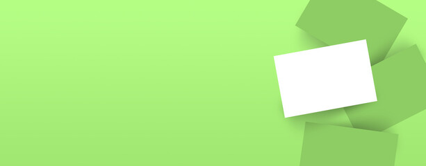 Realistic mockup branding business cards template with shadow on green background. Flat lay, top view.