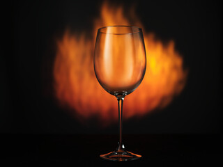 Empty glass of wine on fire background