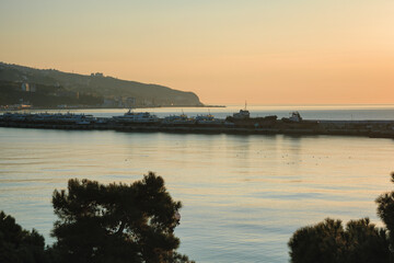 Yalta harbor in a warm light of sunrise, Crimea