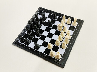 High angle view of travel chess set on a light background © Rix Pix