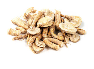 pile of dried parsley roots closeup on white