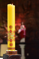 Paschal candle, holy Week,Easter, mass in the church, Catholic Mass, lit candle, happy easter,...