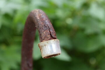 Cracked aerator on rusty faucet pipe