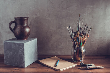 Paint brush and artist tools on table background texture. Paintbrush and art still life