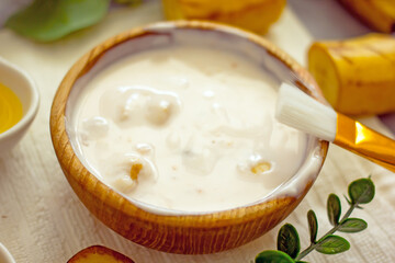 Homemade banana cosmetics. Cosmetic face mask with banana, oatmeal, honey, yolk. Natural skin care, wellness cosmetics,close-up. Diy banana mask,zero waste concept