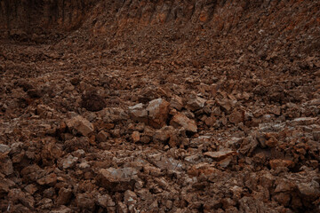 Mud background. The texture of cracks and pieces of earth. Path in the village.