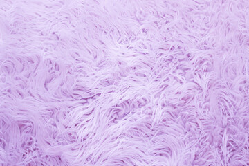 Pink fur artificial texture. Soft and delicate background for designers.