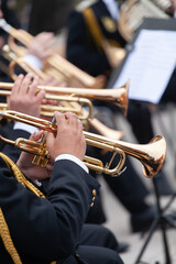 musicians are playing on trumpets