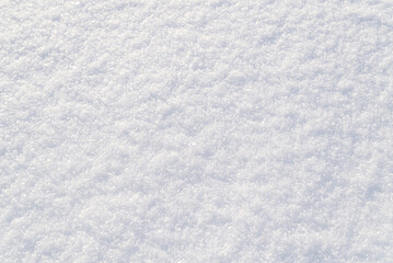 texture of white snow in winter top view. cold background of the winter season