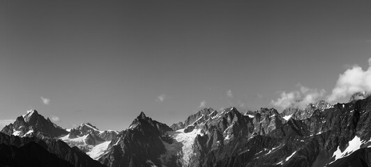 Panorama of high rocky mountains with snow and glacier