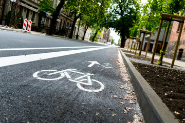 Freshly build bicycle lane in the city,Bike path. Sign white paint on the pavement. Summer. bicycle...