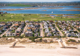 Aerial view over Nassau County on Long Island New York with community of homes in view - 435489984
