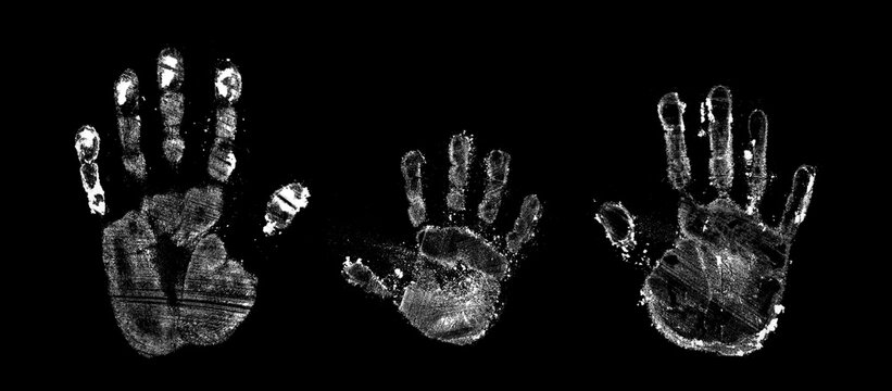 handprint from flour on a black background