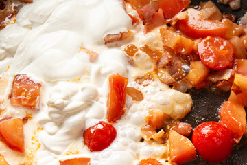 Cooking carbonara, mac and cheese with tomatoes, parmesan, mozzarella cheese