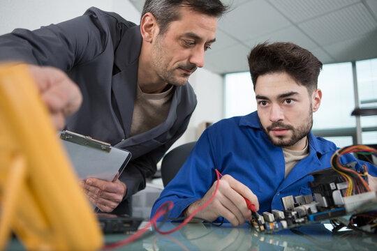 young man working in the robotics classroom