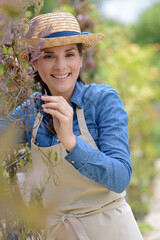 woman gardening outdoors smiling