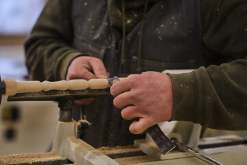 Woodwork and furniture making. Joinery, woodworking and furniture making, professional carpenter cutting wood in carpentry shop, industrial concept