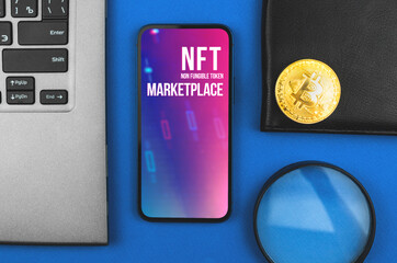 Crypto art and technology, NFT marketplace logo on the screen, office desk with laptop and bitcoin crypto coin, cryptocurrency and business concept, top view photo