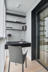 Mini office at the French window on the balcony