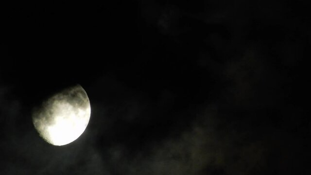 Timelapse Full Moon White Bright With Grey Clouds In Front