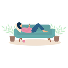 The girl lies on the couch and looks at the phone.