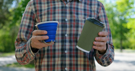zero waste concept, young male use reusable coffee cup	