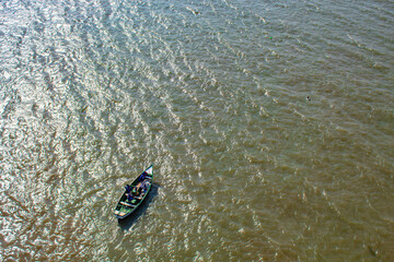 fishing boat in the green sea