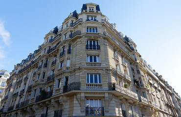 Traditional French house with typical balconies and windows. Paris.