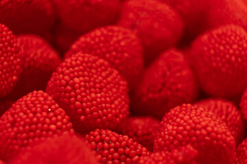 Red sweet jelly like berries and candies with sugar. Macro.