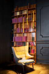 Saint Petersburg, Russia - 07.06.2020: empty white armchair in vintage library with red books