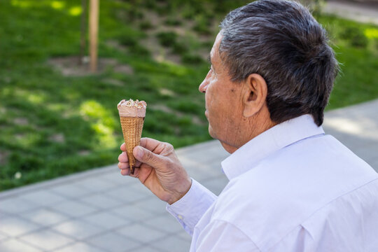 Happy Senior Man Eating Ice Cream