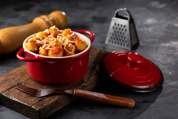 Gnocchi with tomato sauce and grated Parmesan cheese.