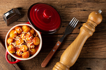 Gnocchi with tomato sauce and grated Parmesan cheese.
