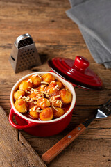 Gnocchi with tomato sauce and grated Parmesan cheese.