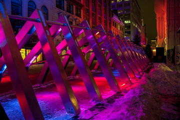 Path of colorful triangles brightly lit for cold winter night in Canada