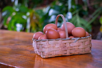 basket of eggs on a wooden table