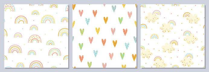 Set of seamless cute patterns. Fun colored cartoon rainbows, hearts, clouds. Sweet dream.
