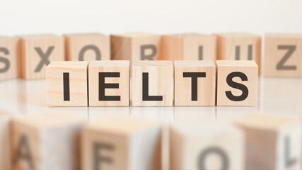 ielts - server message block - letters on wooden cubes on white background, education concept