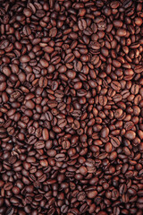Roasted coffee beans with background. Vertical image