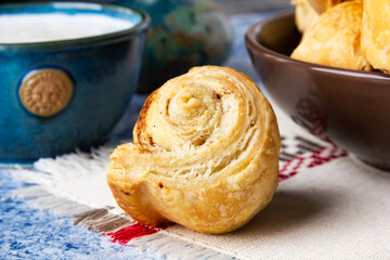 Fresh homemade puff pastry rolls with cinnamon.