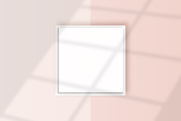 Image of a square white frame mockup on a light pink wall blank mockup template.