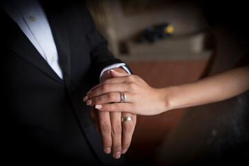close up of rings in a wedding ceremony