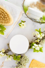 natural cosmetic product, moisturizing cream, herbal mask, brush for dry massage, anti cellulite, stretch marks, wrinkles, for face skin renewal and care on marble background, soft focus