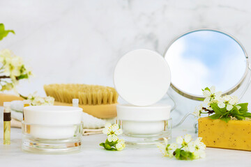 bathroom accessories, natural cosmetic product, moisturizing cream, herbal mask, brush for dry massage, anti cellulite, stretch marks, wrinkles, for face skin renewal and care on marble background